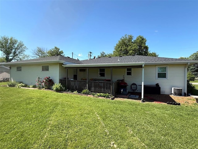 106 W Iowa St, Trenton, IL 62293 - back of property featuring a yard and central AC unit