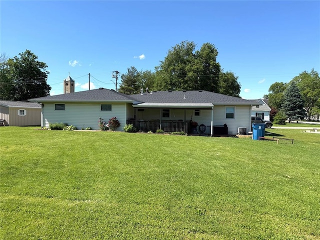 106 W Iowa St, Trenton, IL 62293 - back of house with a lawn, a chimney, and central air condition unit