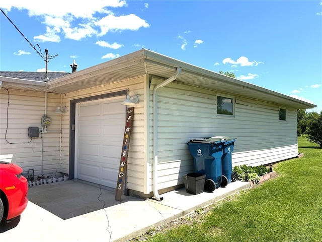 106 W Iowa St, Trenton, IL 62293 - view of home's exterior featuring a garage, concrete driveway, and a yard
