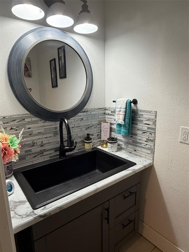 106 W Iowa St, Trenton, IL 62293 - bathroom with backsplash, vanity, and tile patterned flooring