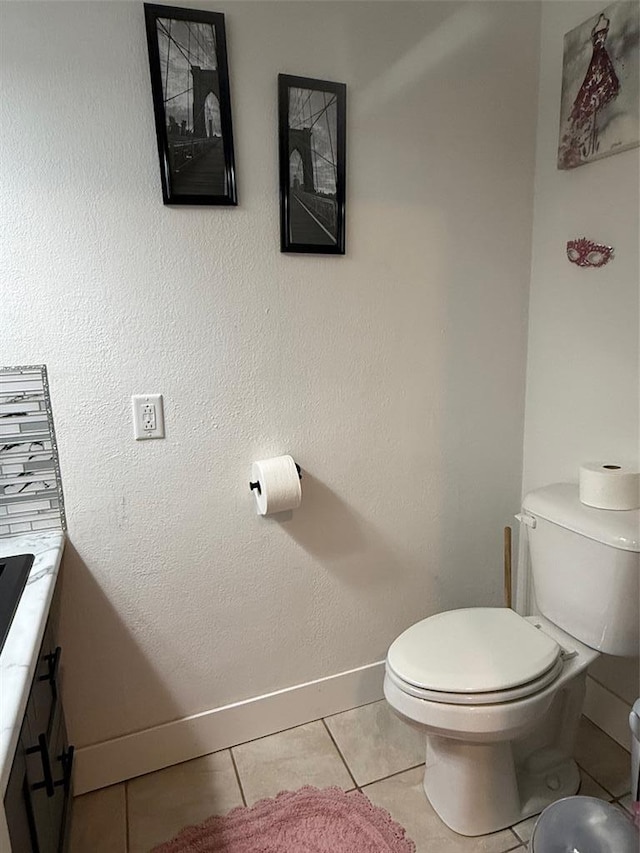 106 W Iowa St, Trenton, IL 62293 - bathroom featuring toilet, vanity, baseboards, and tile patterned floors