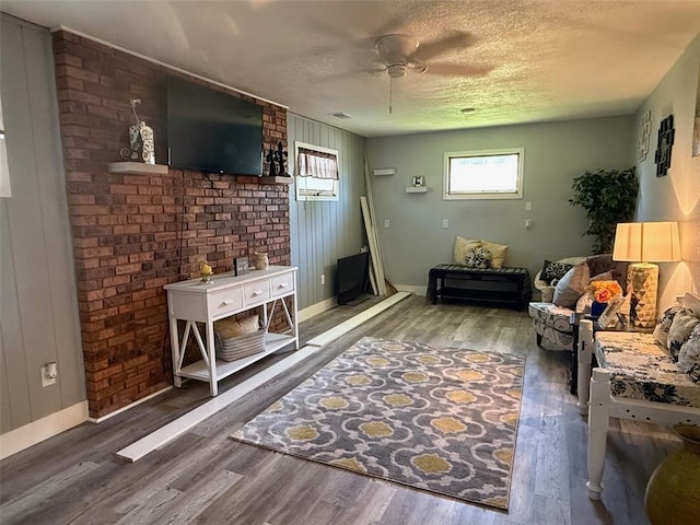 106 W Iowa St, Trenton, IL 62293 - living room with plenty of natural light, wood finished floors, baseboards, and a textured ceiling
