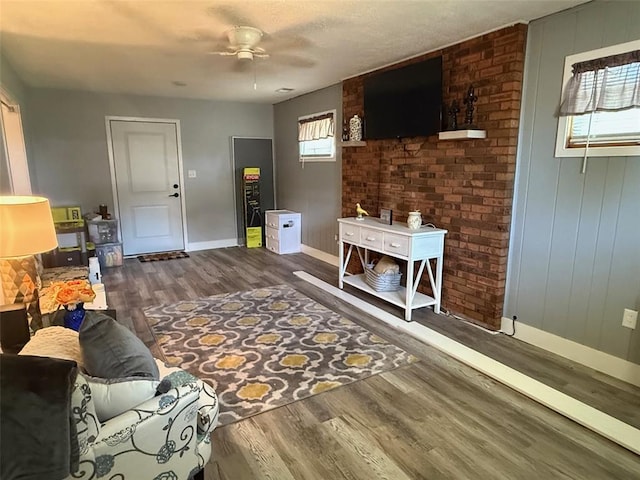 106 W Iowa St, Trenton, IL 62293 - living area featuring plenty of natural light, baseboards, ceiling fan, and wood finished floors
