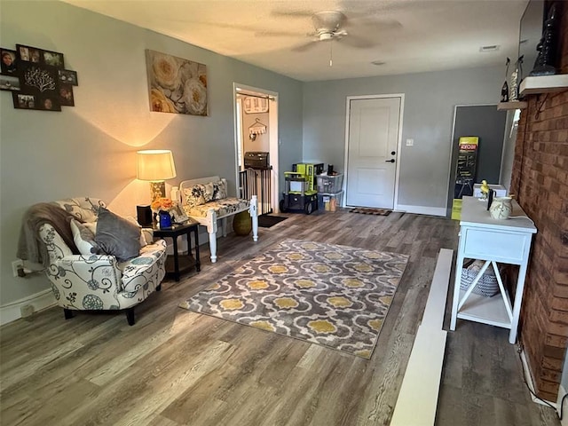 106 W Iowa St, Trenton, IL 62293 - living area with wood finished floors, ceiling fan, and baseboards