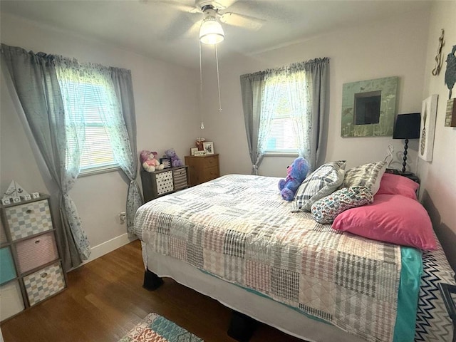106 W Iowa St, Trenton, IL 62293 - bedroom with wood finished floors, a ceiling fan, and baseboards