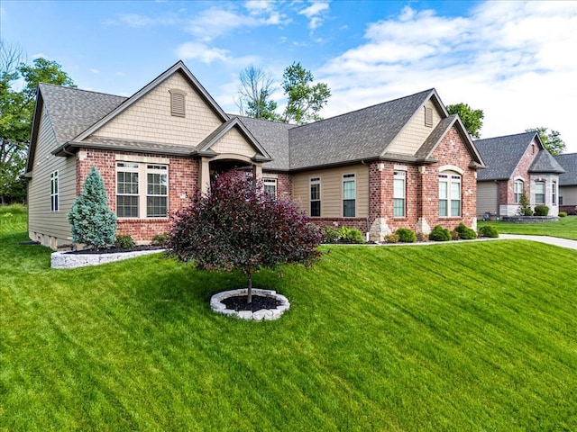 2604 Center Ave, Wildwood, MO 63040 - craftsman-style house with brick siding, a front yard, and a shingled roof