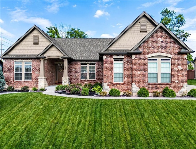 2604 Center Ave, Wildwood, MO 63040 - view of front facade featuring brick siding, a front lawn, and roof with shingles