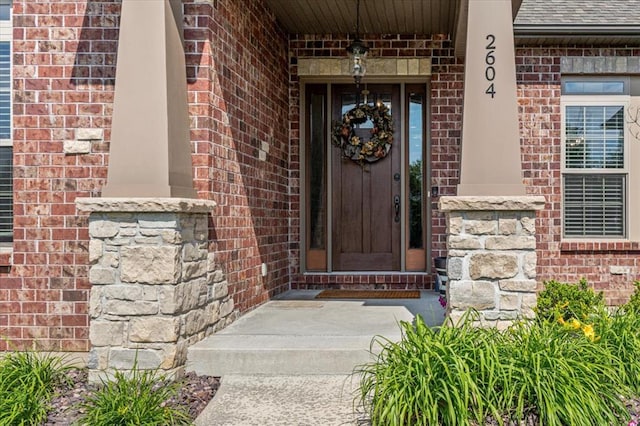 2604 Center Ave, Wildwood, MO 63040 - property entrance with brick siding, roof with shingles, and a porch
