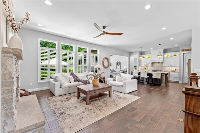 2604 Center Ave, Wildwood, MO 63040 - living room with ceiling fan, recessed lighting, dark wood-type flooring, and baseboards