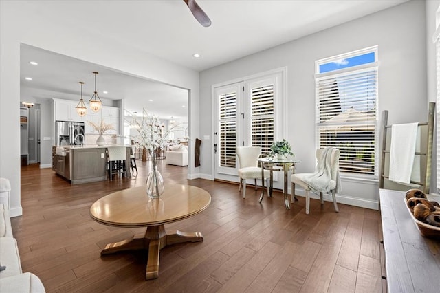 2604 Center Ave, Wildwood, MO 63040 - living area featuring baseboards, recessed lighting, wood finished floors, ceiling fan, and a chandelier