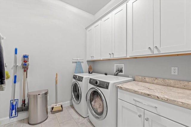2604 Center Ave, Wildwood, MO 63040 - laundry room featuring cabinet space, separate washer and dryer, baseboards, and light tile patterned floors