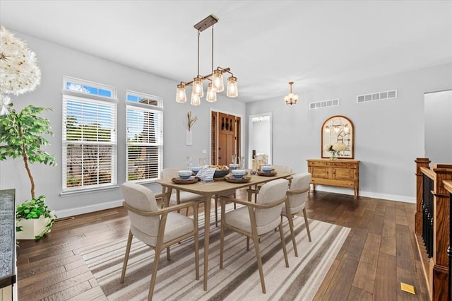 2604 Center Ave, Wildwood, MO 63040 - dining space featuring wood-type flooring, a chandelier, and baseboards