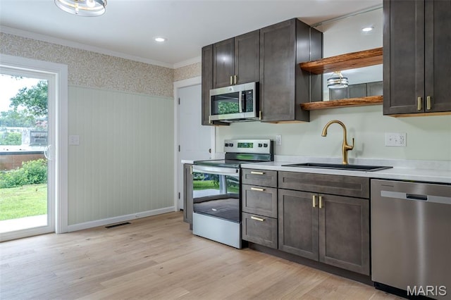 10 Jade Ln, Washington, MO 63090 - kitchen with appliances with stainless steel finishes, light wood-style floors, wallpapered walls, open shelves, and crown molding