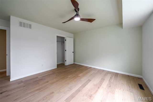 10 Jade Ln, Washington, MO 63090 - unfurnished bedroom with light wood-style flooring, a closet, and a ceiling fan
