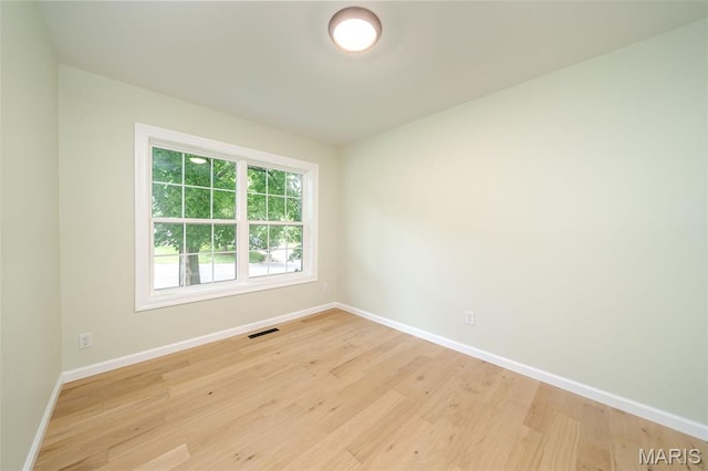 10 Jade Ln, Washington, MO 63090 - unfurnished room with baseboards and light wood-type flooring