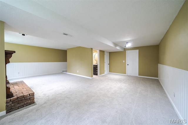 10 Jade Ln, Washington, MO 63090 - unfurnished living room featuring light colored carpet and wainscoting