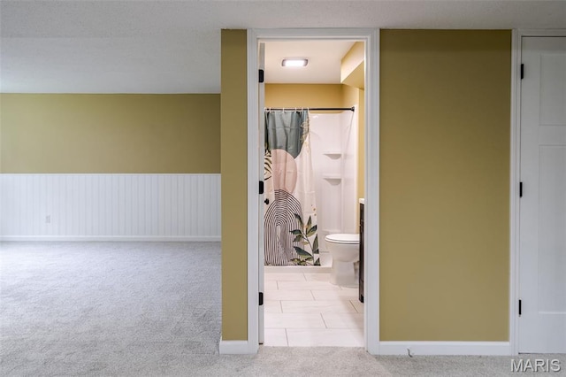 10 Jade Ln, Washington, MO 63090 - hallway featuring carpet flooring and tile patterned flooring