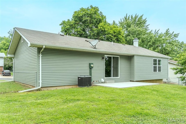 10 Jade Ln, Washington, MO 63090 - back of property with a patio, a yard, and a chimney