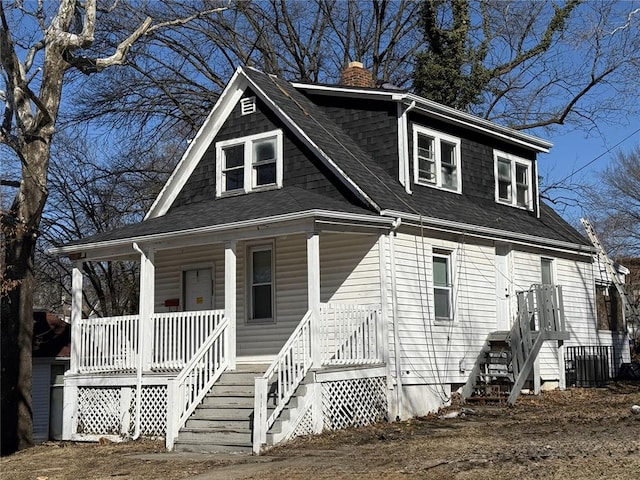 2327 Shirley Ave, Jennings, MO 63136 - view of front facade with a chimney, a porch, and a shingled roof