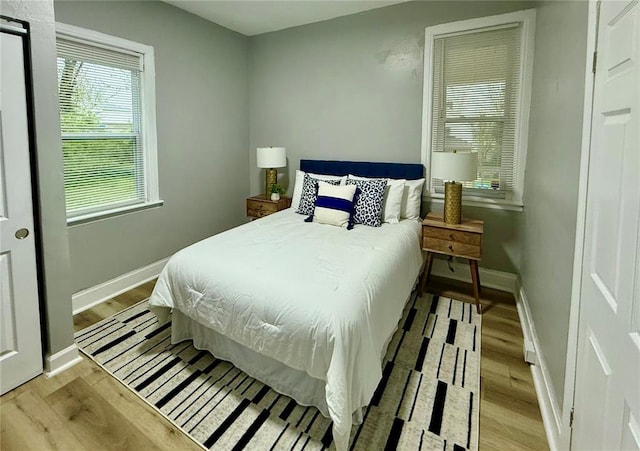 2327 Shirley Ave, Jennings, MO 63136 - bedroom with wood finished floors and baseboards