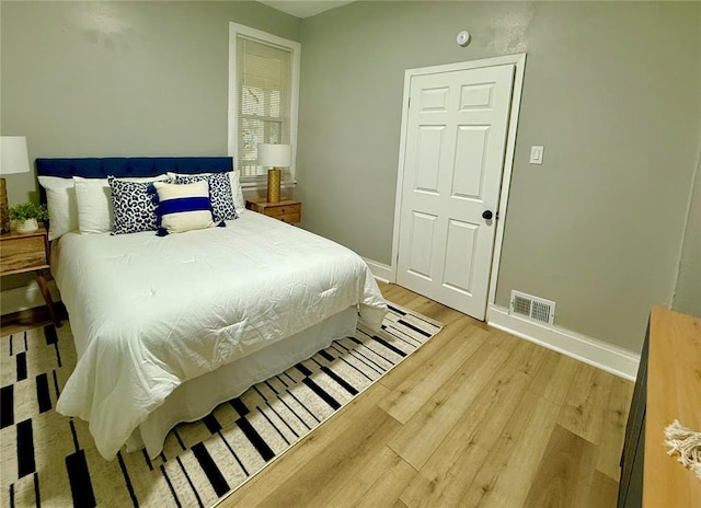 2327 Shirley Ave, Jennings, MO 63136 - bedroom with light wood-style flooring and baseboards