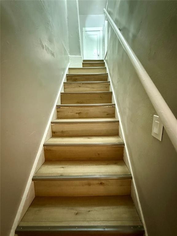 2327 Shirley Ave, Jennings, MO 63136 - staircase featuring wood finished floors