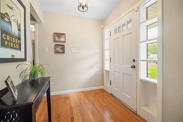 5 Homestead Acres, Olivette, MO 63132 - entrance foyer featuring light wood-style floors, baseboards, and a chandelier