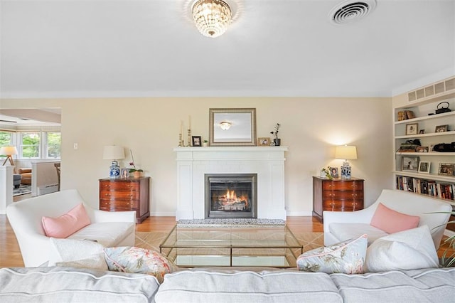 5 Homestead Acres, Olivette, MO 63132 - living room featuring a glass covered fireplace and built in features