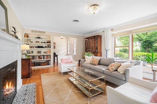 5 Homestead Acres, Olivette, MO 63132 - living room with a glass covered fireplace and light wood finished floors