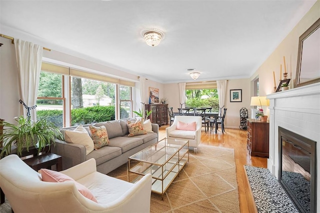 5 Homestead Acres, Olivette, MO 63132 - living area featuring light wood-style flooring and a fireplace with flush hearth