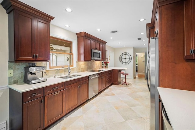 5 Homestead Acres, Olivette, MO 63132 - kitchen featuring a sink, stainless steel appliances, tasteful backsplash, recessed lighting, and light countertops