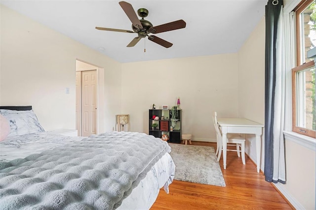 5 Homestead Acres, Olivette, MO 63132 - bedroom featuring multiple windows, light wood-style floors, baseboards, and ceiling fan
