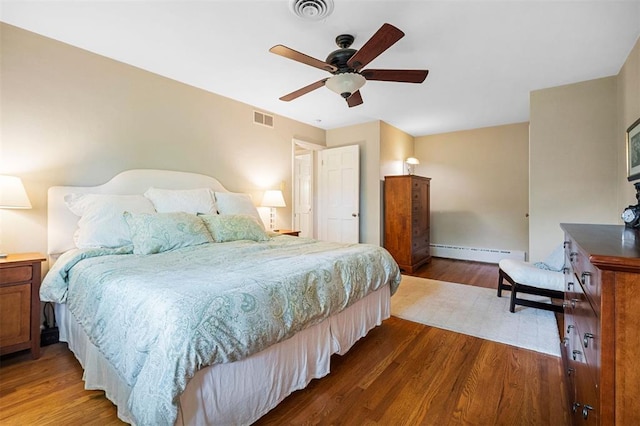 5 Homestead Acres, Olivette, MO 63132 - bedroom featuring a baseboard radiator, dark wood-style floors, baseboards, and a ceiling fan