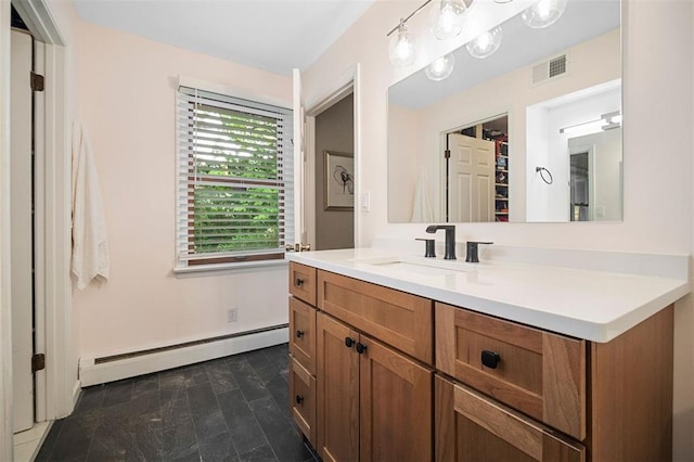 5 Homestead Acres, Olivette, MO 63132 - bathroom featuring a baseboard heating unit, vanity, and baseboards