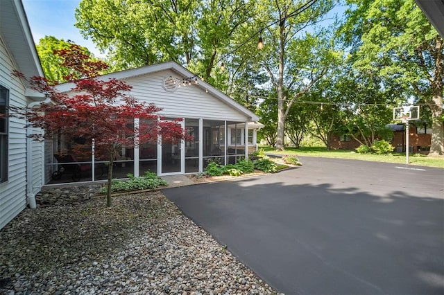 5 Homestead Acres, Olivette, MO 63132 - view of side of property with a sunroom and a patio area