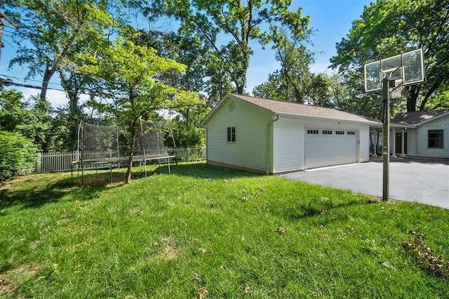 5 Homestead Acres, Olivette, MO 63132 - view of yard featuring a trampoline, driveway, and an attached garage
