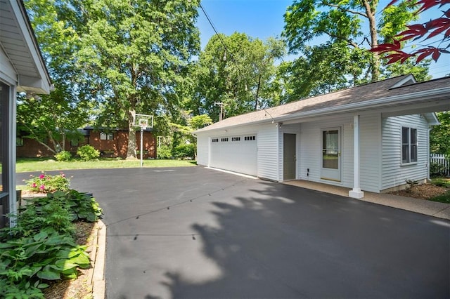 5 Homestead Acres, Olivette, MO 63132 - view of property exterior with driveway, a garage, and a shingled roof