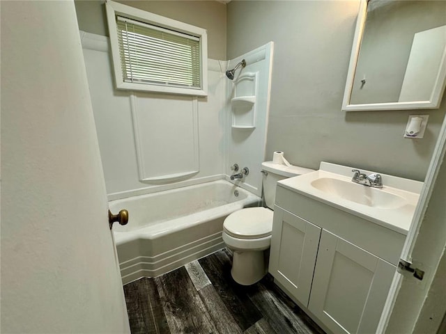 317 Marion Ave, Sikeston, MO 63801 - bathroom with vanity, wood finished floors, toilet, and shower / bath combination