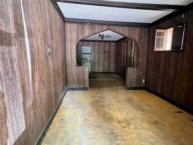 4240 California Ave, Saint Louis, MO 63111 - hallway with wood walls, arched walkways, beam ceiling, and baseboards