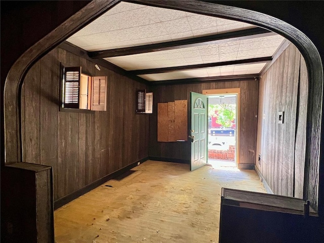 4240 California Ave, Saint Louis, MO 63111 - corridor with wooden walls, light wood-type flooring, arched walkways, beam ceiling, and baseboards