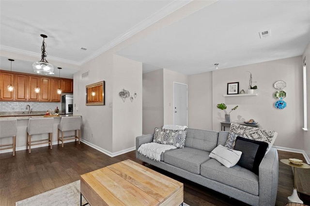 230 N Boyle Ave Unit B, Saint Louis, MO 63108 - living area with dark wood-style floors, baseboards, and crown molding