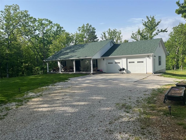 12460 Grassy Hollow Rd, Potosi, MO 63664 - view of home's exterior with driveway, a garage, a porch, a yard, and roof with shingles