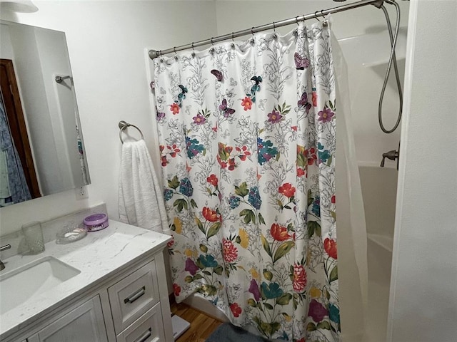 12460 Grassy Hollow Rd, Potosi, MO 63664 - full bathroom with a shower with curtain, vanity, and wood finished floors