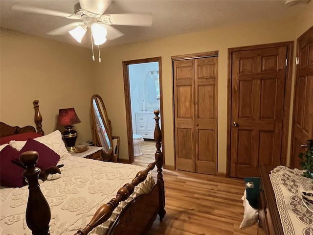 12460 Grassy Hollow Rd, Potosi, MO 63664 - bedroom with light wood-type flooring, ensuite bath, and ceiling fan