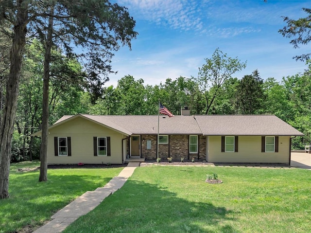 single story home featuring a front yard, a chimney, and roof with shingles