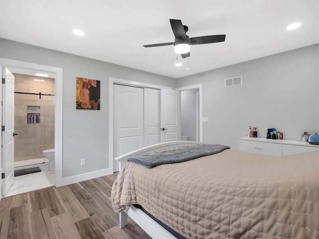 bedroom with a closet, baseboards, wood finished floors, recessed lighting, and ceiling fan