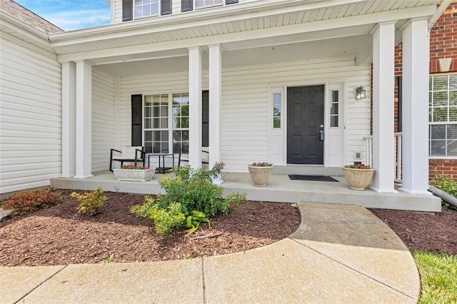313 Golden Cherry Dr, Wildwood, MO 63040 - entrance to property with a porch and brick siding