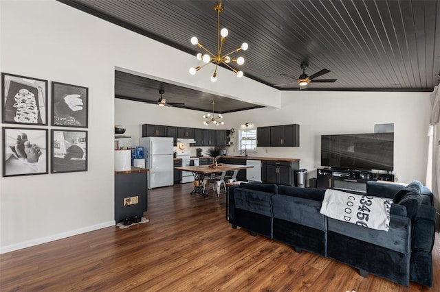213 Quarry St, Staunton, IL 62088 - living room with a chandelier, ceiling fan, dark wood finished floors, and baseboards