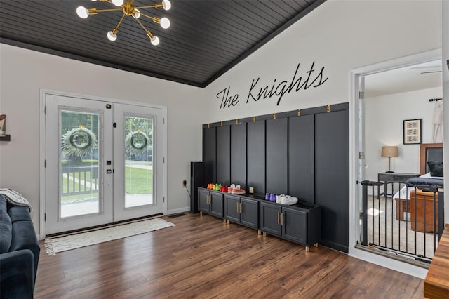 213 Quarry St, Staunton, IL 62088 - mudroom featuring wood finished floors, lofted ceiling, a chandelier, and baseboards