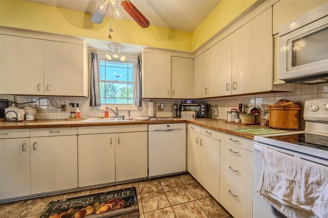 310 Smith Rd, Lebanon, MO 65536 - kitchen featuring white appliances, a sink, tasteful backsplash, a ceiling fan, and light countertops
